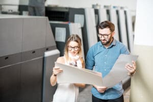 woman and print operator at the printers